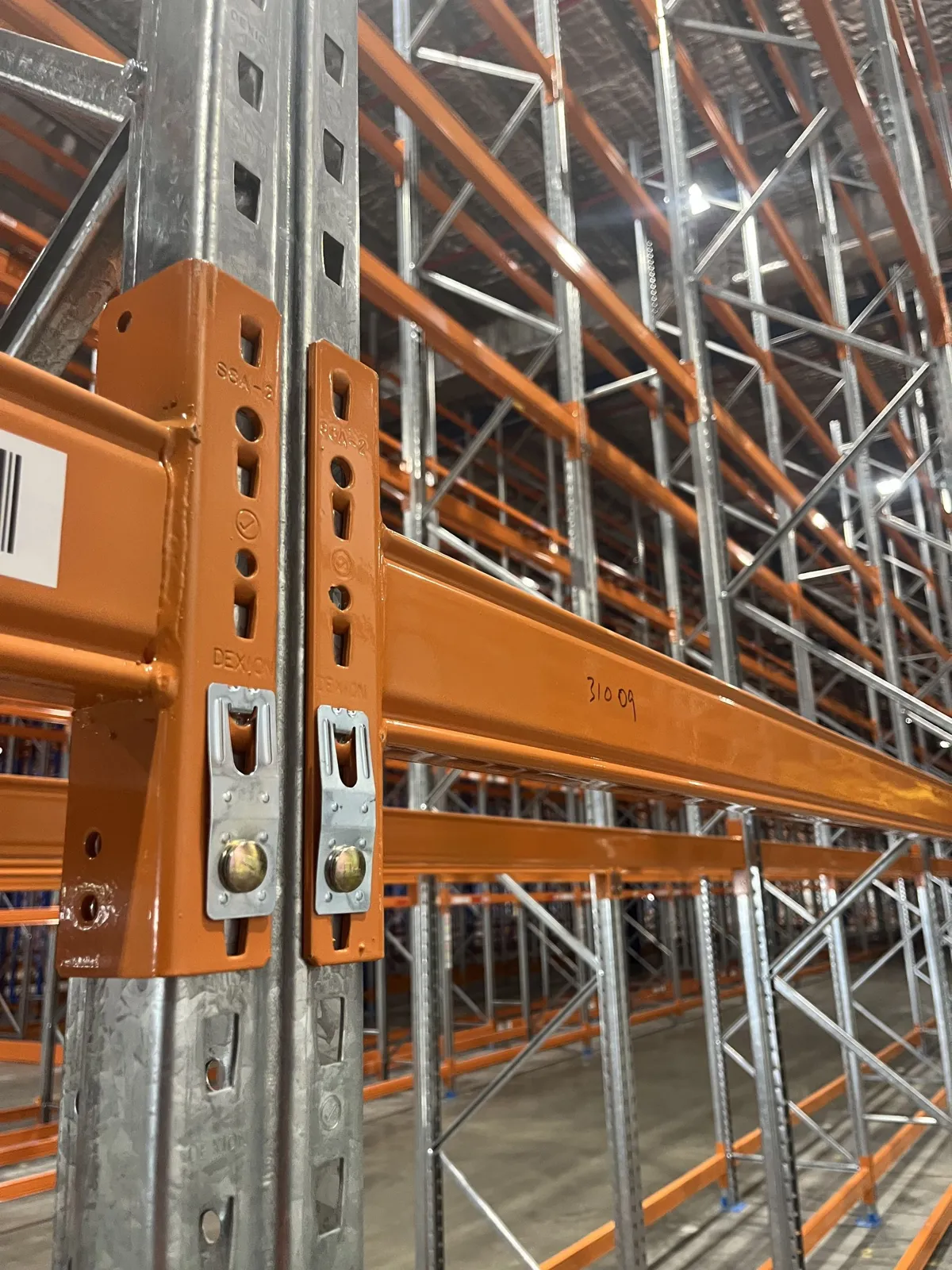 Orange pallet racking installed for a Central Coast warehouse