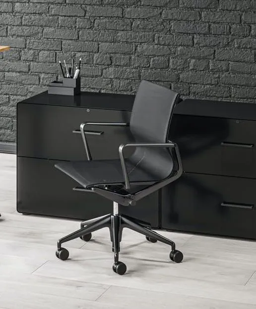 Black office chair and storage credenza from the office furniture range